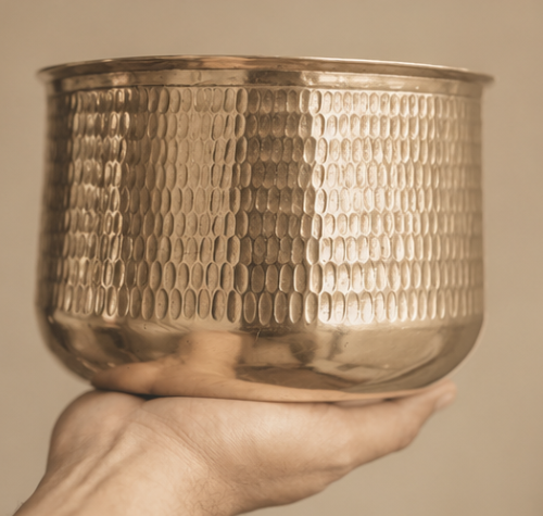 Copperware and brassware arrangement